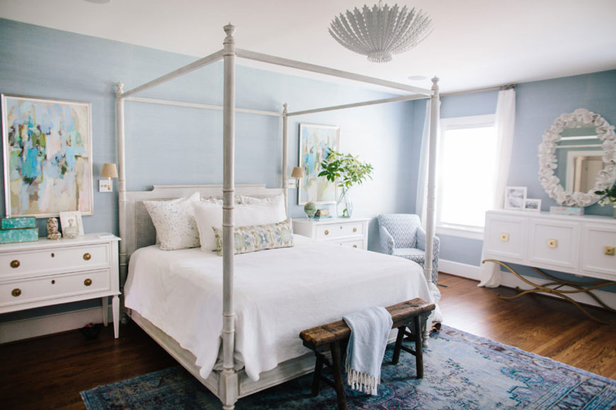 master bedroom with blue walls and wood floors