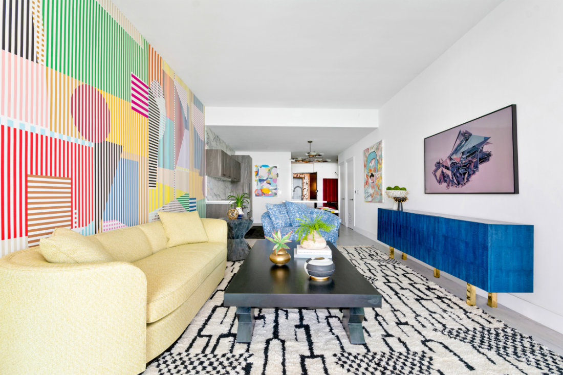 yellow-couch-rainbow-mural-wall-pattern-rug