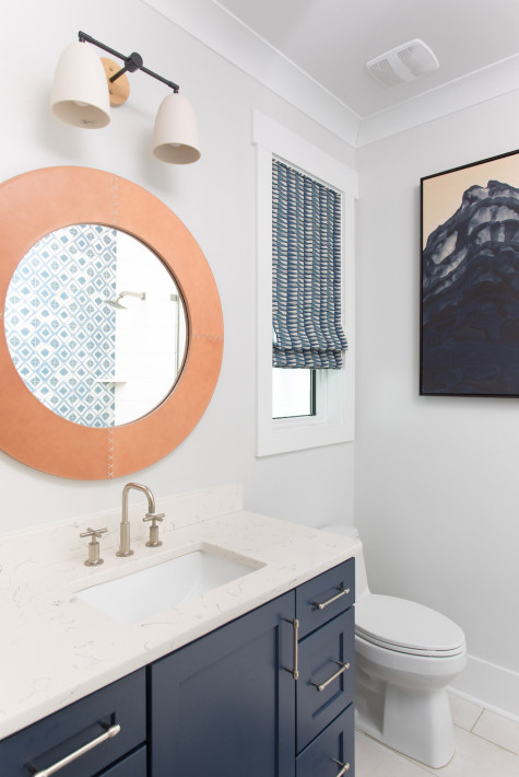 round-orange-mirror-bathroom-interior-design-navy-and-white